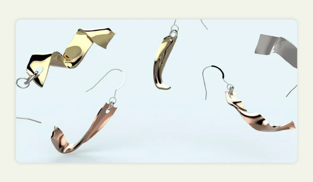 Gold earrings with twisted designs created via 3D printing