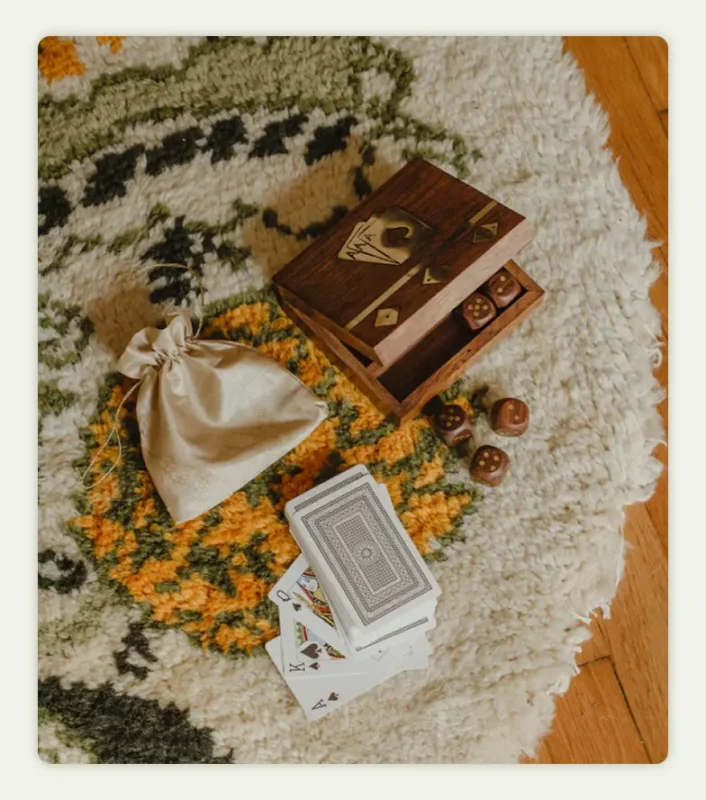 A flat lay photo of a card and dice game