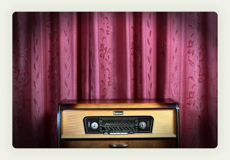 Audio speakers and display screen showing music guessing game interface 