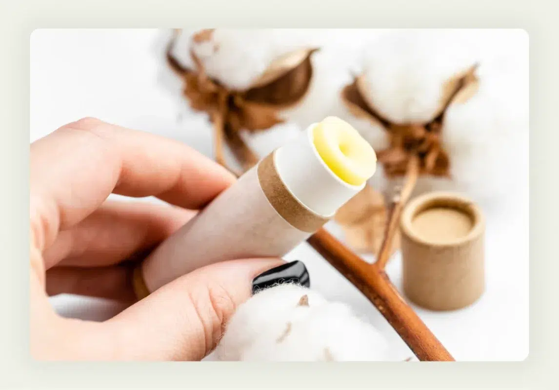 Branded lip balm tubes and hand sanitizer bottles arranged as trade show promotional items Branded lip balm tubes and hand sanitizer bottles arranged as trade show promotional items