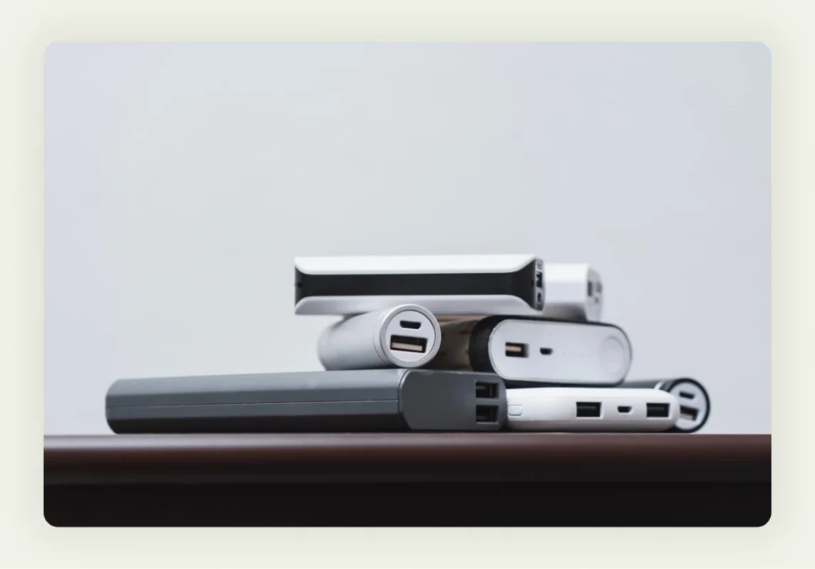 Branded portable power banks and phone chargers displayed as tech trade show giveaways Branded portable power banks and phone chargers displayed as tech trade show giveaways