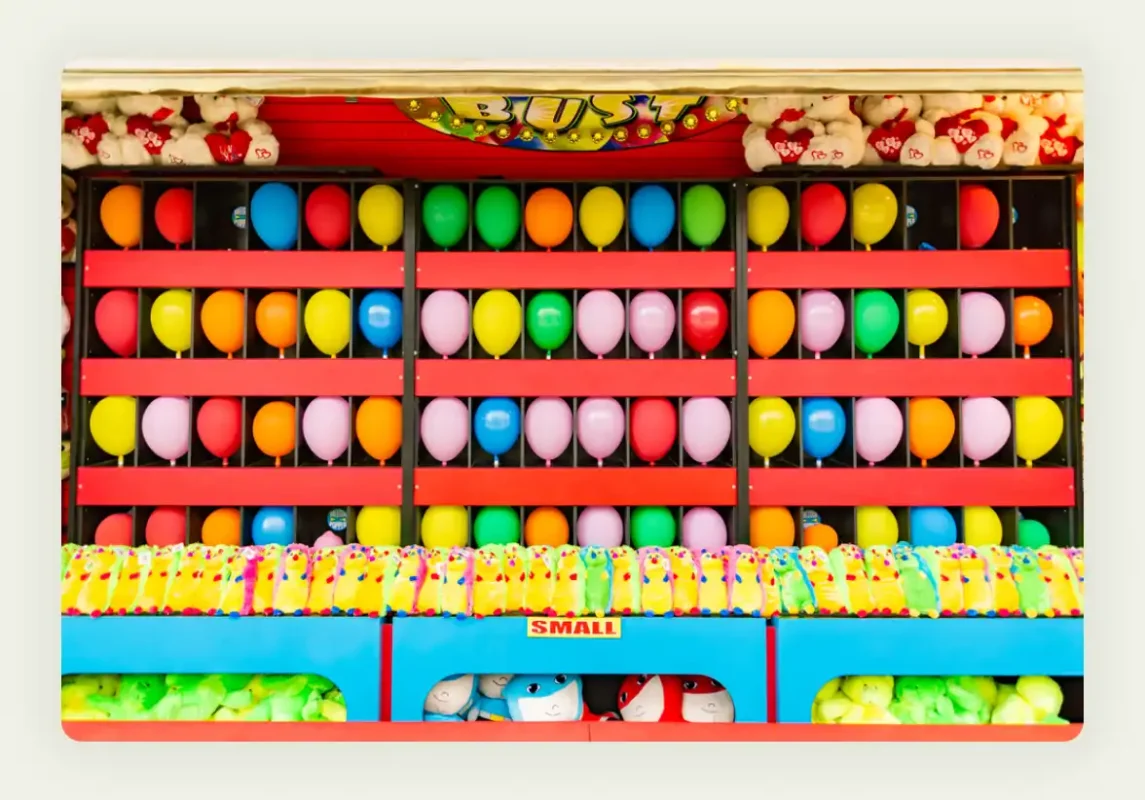 Carnival-style ring toss and basketball games set up at trade show booth Carnival-style ring toss and basketball games set up at trade show booth