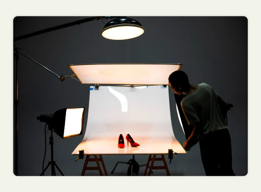 Studio setup with softbox lighting against a glossy backdrop to control reflections