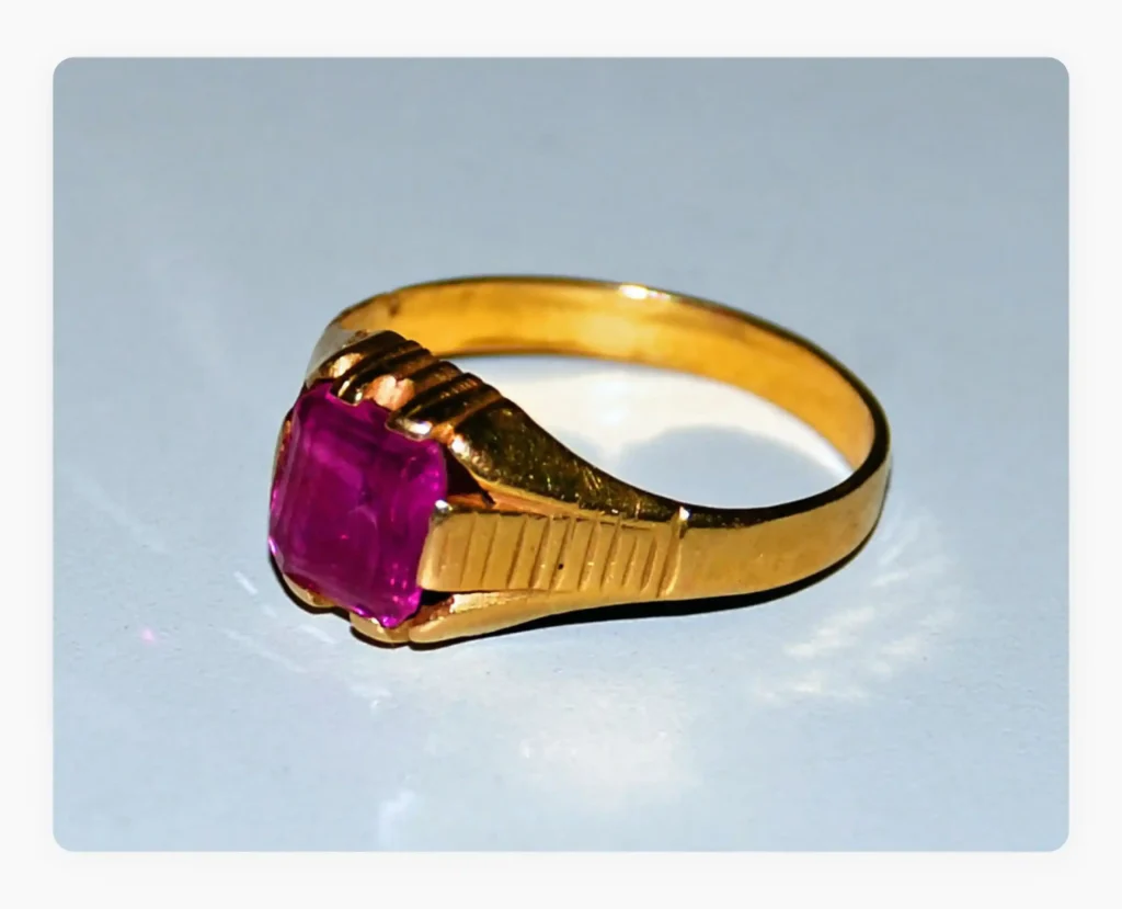 A gold ring in a plain background